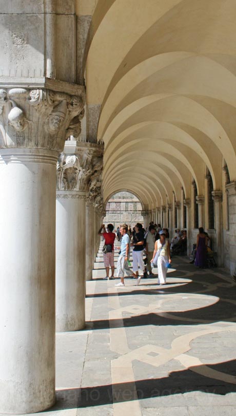 Corinthian style columns with gothic arcades in doges palace venice photo