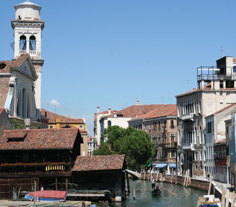 Gondola on a venetian channel photo