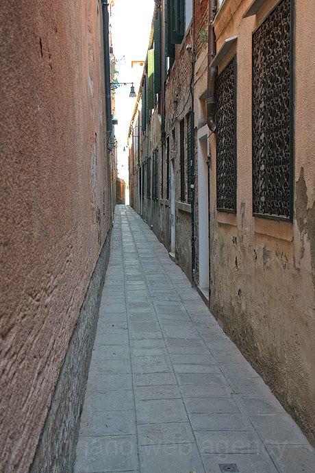 Venetian long narrow street photo